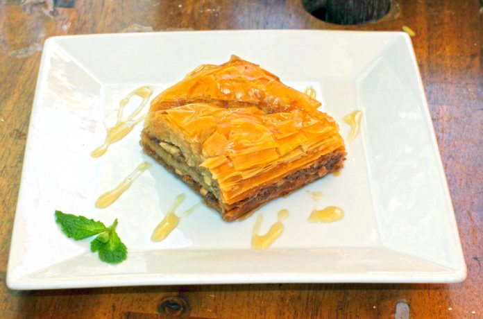Key West goes Mediterranean - A piece of cake sitting on top of a wooden table - Treacle tart