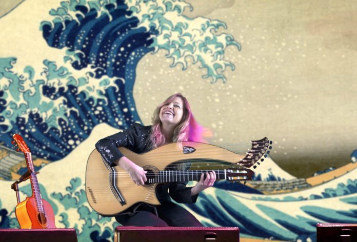 Upper Keys: BRINGING STRINGS - A person holding a guitar - The Great Wave off Kanagawa