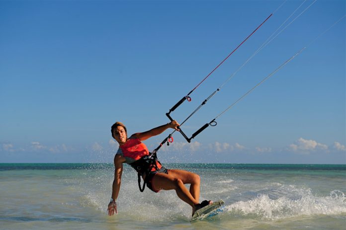ISLAMORADA: Anne’s Beach gets facelift - A man riding on top of a body of water - Kitesurfing