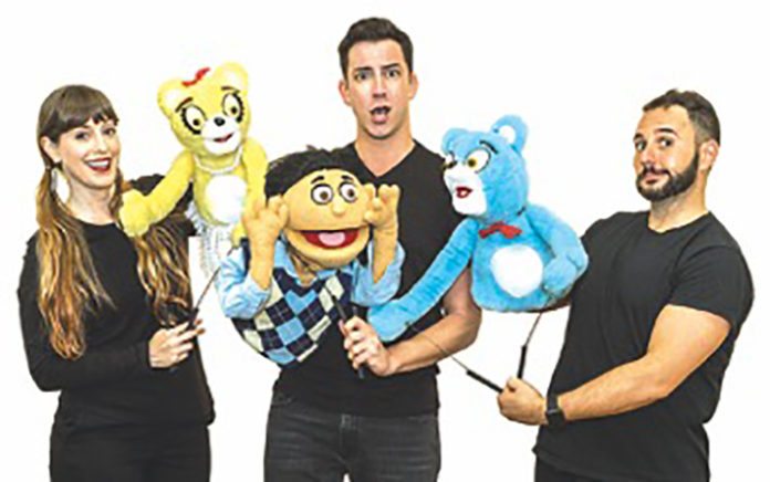 Smart, sassy, supremely clever – Avenue Q’ at the Waterfront Theater - A group of people posing for the camera - Human behavior