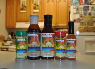 HOT AND SPICY: Sauce and seasoning masters redefine Keys heat - A bottle of wine on a table - Hot Sauce
