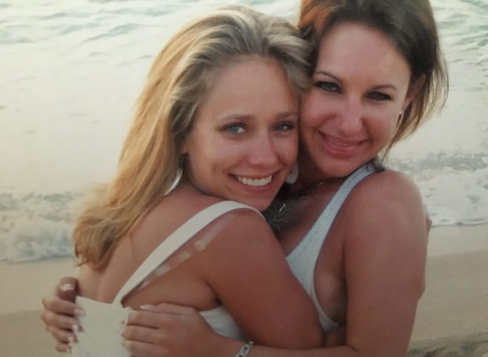 In memory: Jessica Lynn Irwin - A woman sitting on a beach posing for the camera - Words of My Life