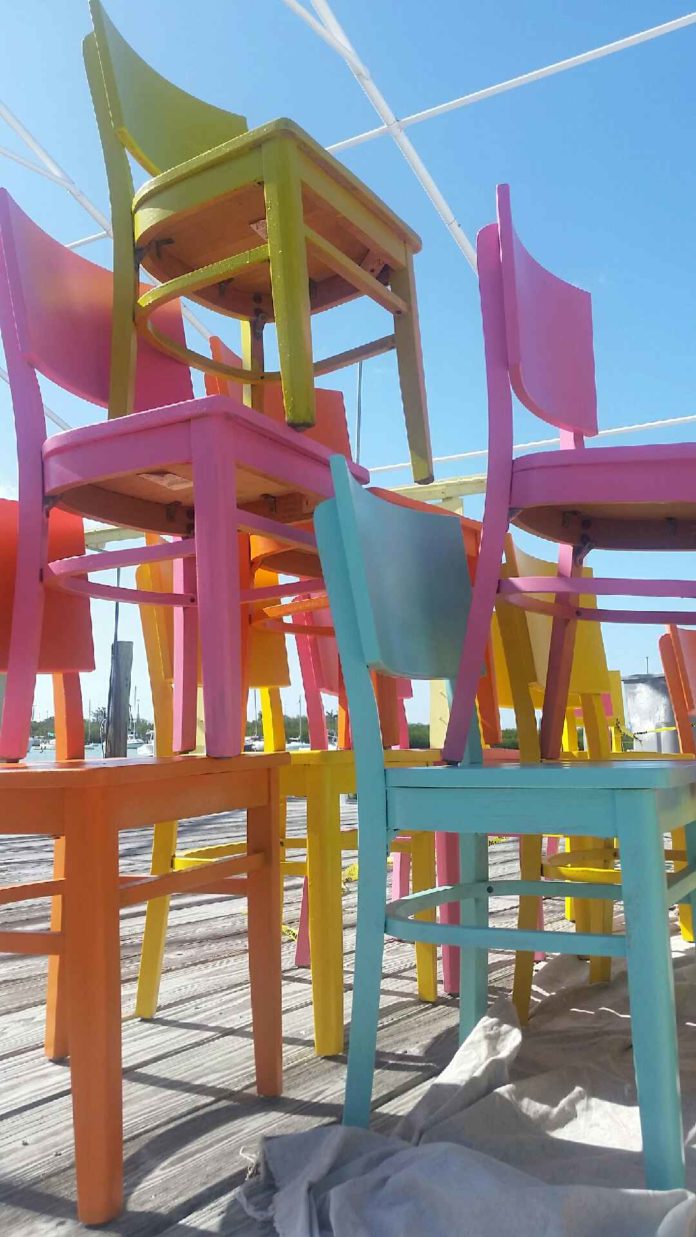 MARATHON: Dockside under new ownership - An umbrella sitting on top of a wooden chair - Florida Keys