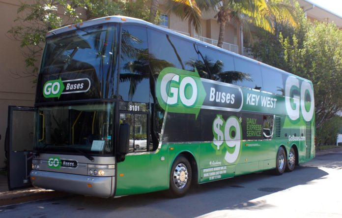 The new go buses offer low cost trips to mainland - A bus that is parked on the side of a road - Bus