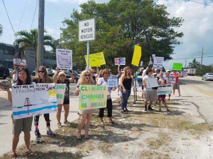 Future of Fracking in Florida - A group of people holding a sign - Protest
