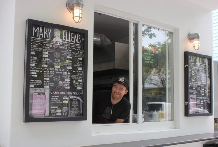 Mary Ellen’s: Say cheese, grilled cheese - A person standing in front of a window - Mary Ellen's Bar & Restaurant