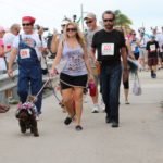Cow Key Bridge Run: Show us your teats - A group of people posing for the camera - Cow Key