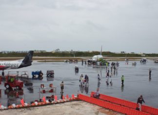 Checking in at EYW - A group of people sitting at a dock - Key West International Airport