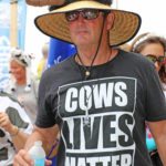 Cow Key Bridge Run: Show us your teats - A man wearing a hat - Cow Key
