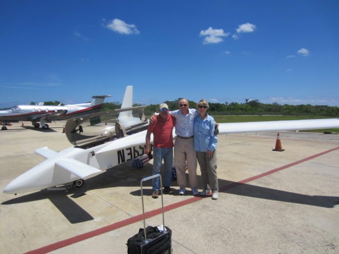 OPEN SKIES TO CUBA - A group of people standing around a plane - Aviation