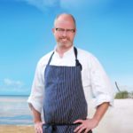 ReMARCable Surf & Turf Fundraiser - A man standing next to a body of water - Celebrity chef