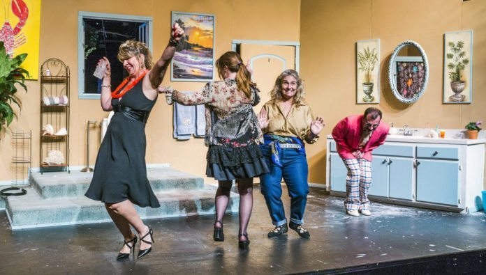 ‘Bathroom Humor’ opens at MCT - A group of people standing in a room - Strobe light