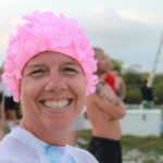 Tri-umphant at MaraTri - A person wearing a hat and smiling at the camera - Triathlon