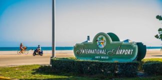 Monroe County closes KW airport, animal shelters; LKMC closes too - A sign on the side of the road - Key West International Airport