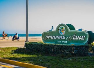 Monroe County closes KW airport, animal shelters; LKMC closes too - A sign on the side of the road - Key West International Airport