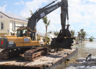 Marine debris removal begins in Keys canals - A large truck - Demolition