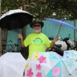 Annual Crooks Second Line - A person holding a colorful umbrella - Umbrella