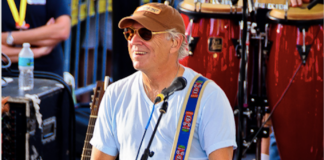 How Key West is becoming “Music Town” USA. - Jimmy Buffett holding a guitar