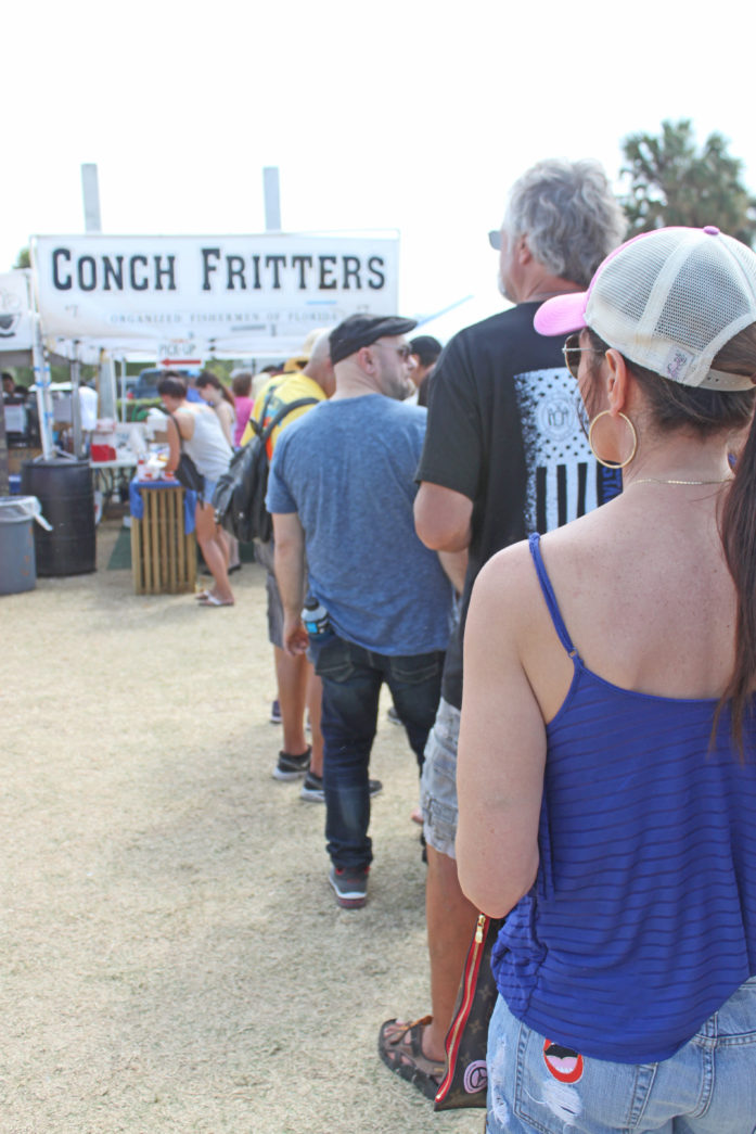 Getting their fill – Seafood Festival draws a crowd - A group of people standing in front of a crowd - iT'Z