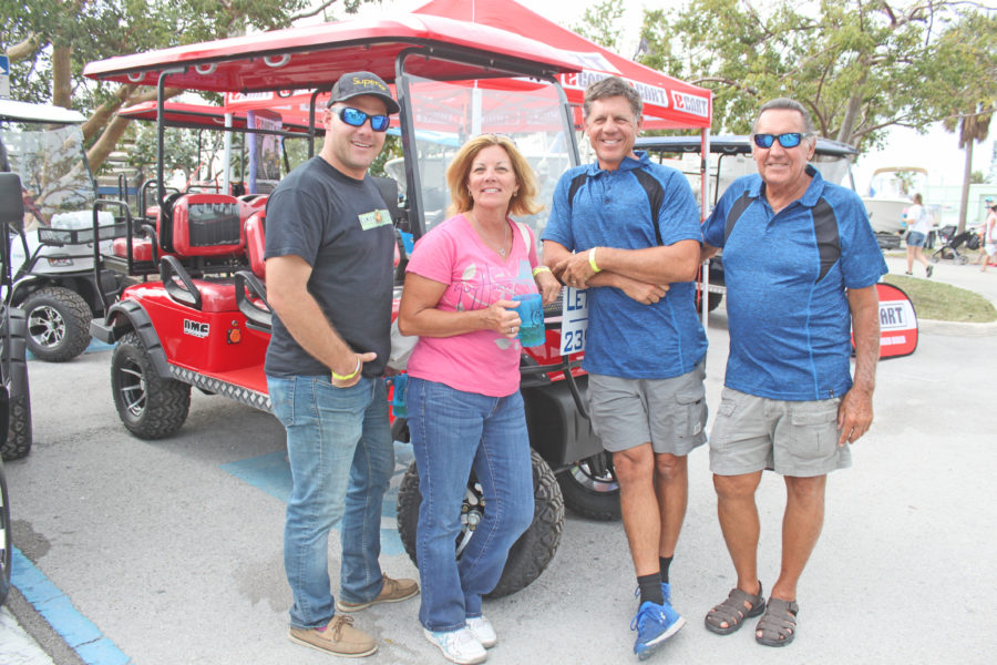 Getting their fill – Seafood Festival draws a crowd - A group of people standing next to a truck - Car