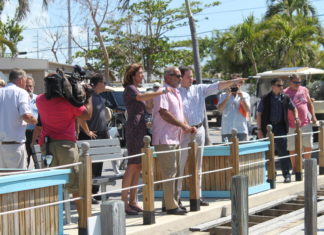 ‘I’ll call today’ – Rubio promises support for FEMA funds, canal cleanup - A group of people standing next to a fence - Crowd