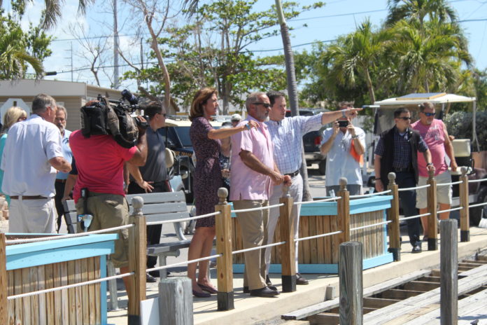 ‘I’ll call today’ – Rubio promises support for FEMA funds, canal cleanup - A group of people standing next to a fence - Crowd