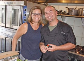 Catering to Your Needs - A man and woman preparing food in a kitchen - Socialite