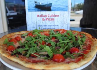 Pizza with pizzazz – Triton Seafood Restaurant adds new menu - A pizza sitting on top of a table - California-style pizza