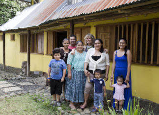 New Menu New Venue - A group of people standing in front of a house - Family