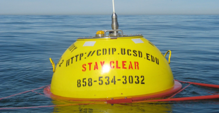Last piece of intel – New buoy helps boaters - A small yellow boat on a body of water - Buoy