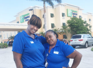 HELP WANTED – Resorts struggle to fill positions - A person in a blue shirt standing in front of a building - T-shirt
