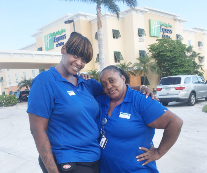 HELP WANTED – Resorts struggle to fill positions - A person in a blue shirt standing in front of a building - T-shirt