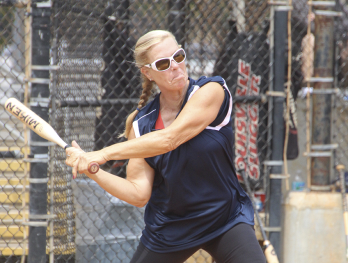 PLAY BALL – Fourth annual Stiglitz tourney Saturday and Sunday - A woman swinging a baseball bat - Competition