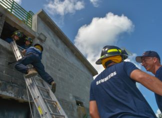 Visiting ‘Bomberos’ – Argentinian firefighters train in the Keys - A group of baseball players standing on top of a ramp - Laborer