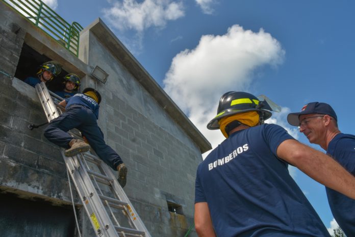 Visiting ‘Bomberos’ – Argentinian firefighters train in the Keys - A group of baseball players standing on top of a ramp - Laborer