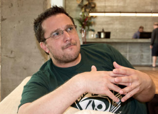 All quiet in Key West? Nope - Billy Corben sitting on a table - Human behavior