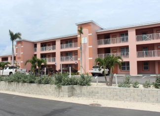 ‘We’ll take em’’ - A group of people in front of a building - Condominium