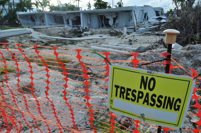 AT RISK – Lower Matecumbe especially vulnerable this hurricane season - A sign in front of a fence - Lower Matecumbe Key