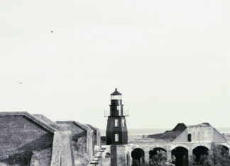 THE LIGHTHOUSE - A vintage photo of an old building - History