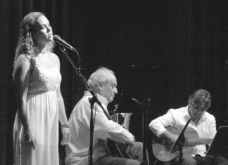 Onward and upward - A man and a woman standing on a stage - Concert