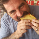 The 7 Deadly “SINZ” of Eli Pancamo - A man eating a hot dog - Junk food