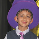 That’ll do, Donkey - A young boy wearing a hat posing for the camera - Fedora