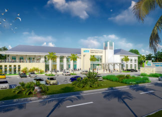 FKCC buys plot for Upper Keys campus - A road with palm trees and a building - College of the Florida Keys