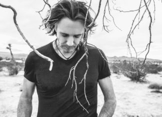 Exclusive interview with Rick Springfield - A young man standing on top of a dirt field - Rick Springfield