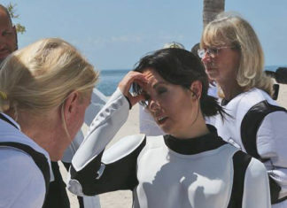Leadership project encourages cleaner Keys - A group of people standing next to a person - Personal protective equipment