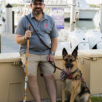 25 Disabled Veterans Are Honored - A person and a dog on a leash - Dog breed