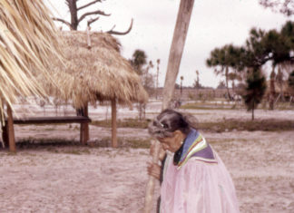 The Coontie - A group of people standing in the dirt - Seminole