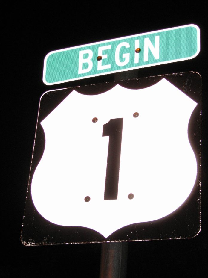 How long is the Overseas Highway? - A close up of a sign - Overseas Highway