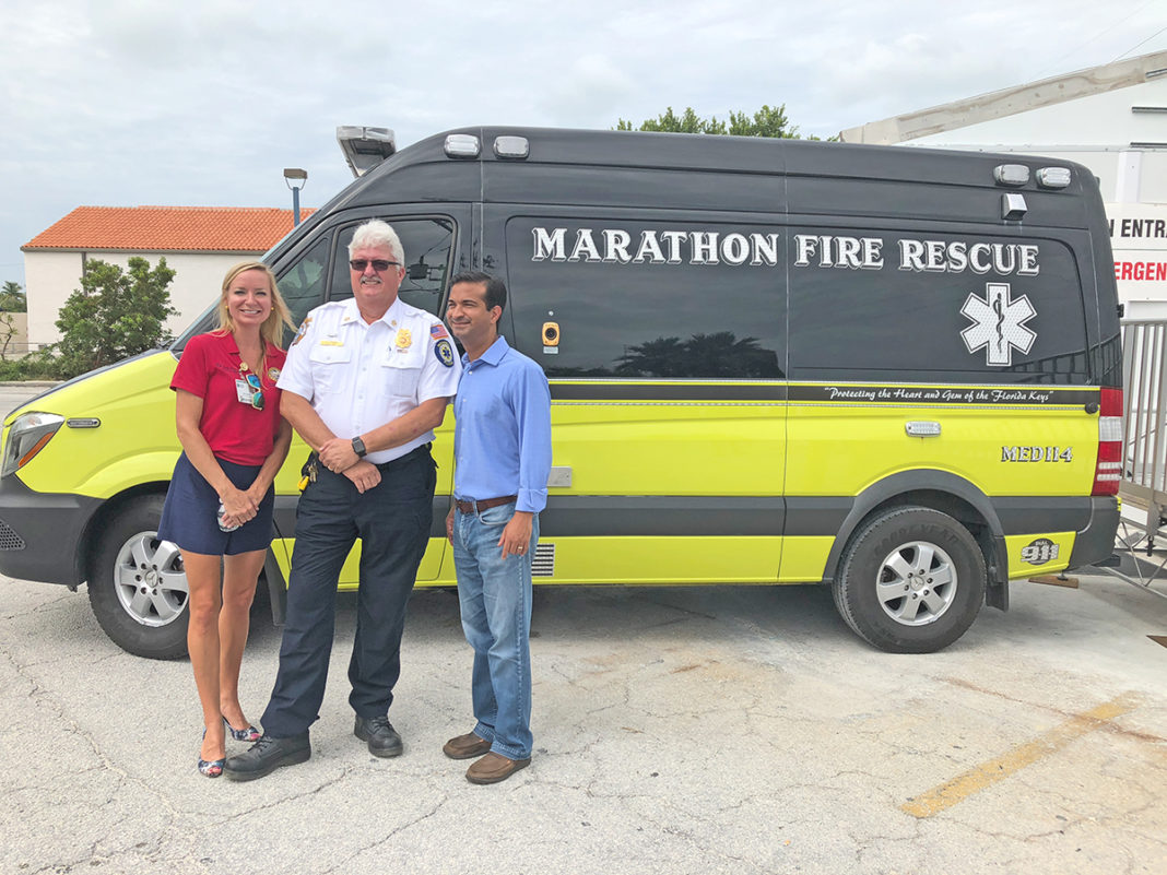 Rubio, Curbelo and more tour Marathon one year after Irma - Carlos Curbelo et al. standing in front of a truck - Marco Rubio