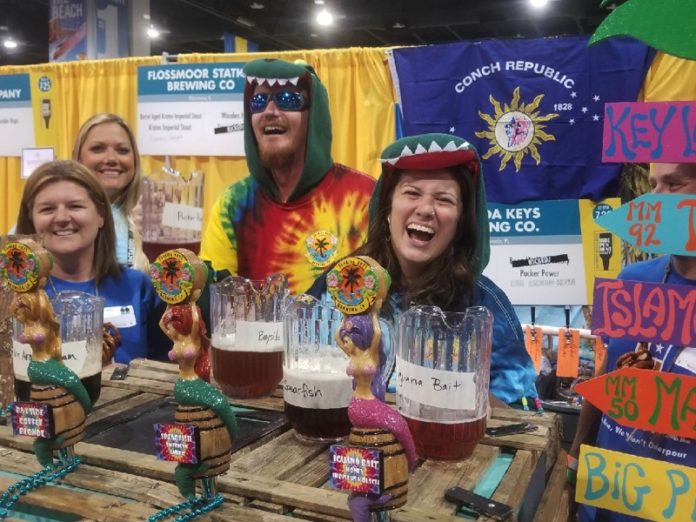 Florida Keys Brewing showcases at Colorado beer festival - A group of people posing for a photo in front of a store - Brewery